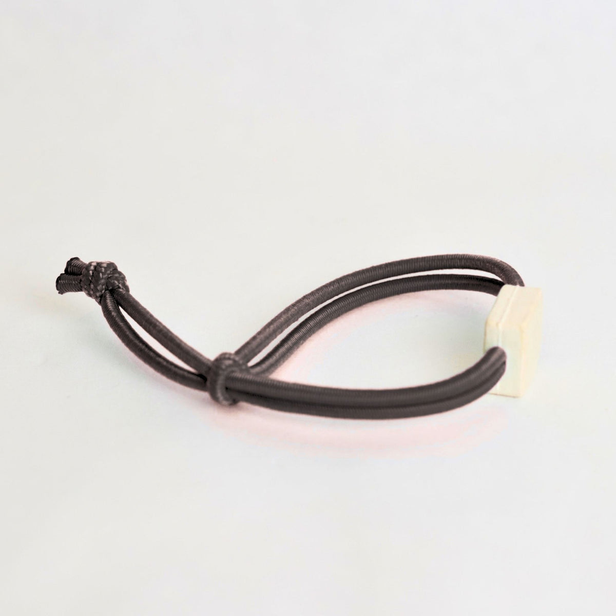Tap-to-Phone Bracelets on Active Bungee - Cream Clay Square