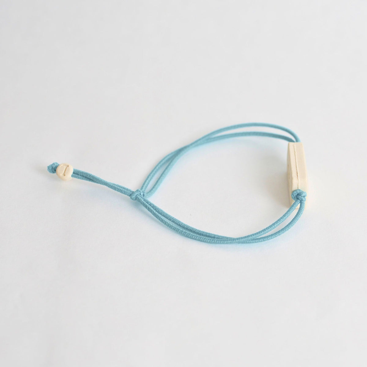 Tap-to-Phone Bracelets on Lite Bungee - Cream Clay Rectangle